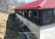 Gospodărie cuprinsă de flăcări de la un incendiu de vegetație la Laza